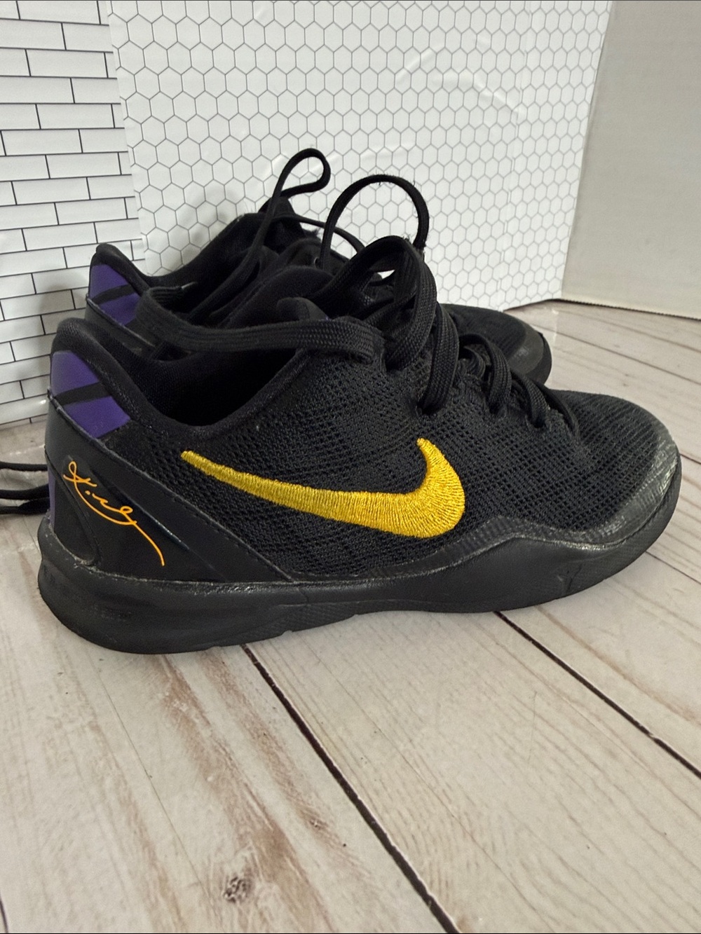 Nike Kids Black Sneakers with Yellow Swoosh and Purple Heel Accents